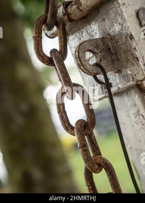 rusty chain and metal lock on the fence gate Stock Photo