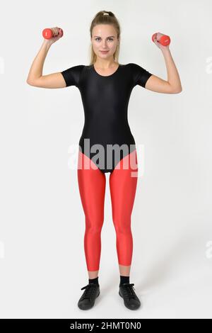 Woman wearing a shiny spandex leaotard and leggings, sports wear of the  80s/90s Stock Photo - Alamy