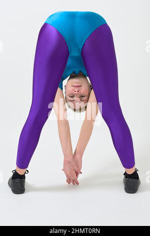 Young woman wearing a shiny spandex unitard doing push-ups Stock Photo -  Alamy