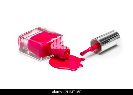 bottle with spilled nail polish over white background Stock Photo