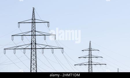 Electricity pylon power pole high voltage against blue sky Stock Photo