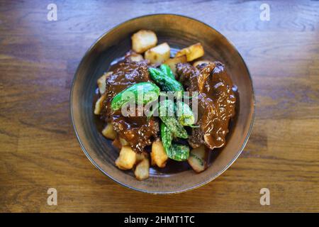 Bull's tail cooked and ready to eat in a Spanish restaurant Stock Photo