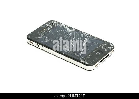 Studio shot of an iPhone 5s with seriously broken retina display screen isolated on white. iPhone 5 is a smartphone developed by Apple Inc. Stock Photo