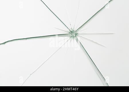 Broken window glass crack splitter on white gray background Stock Photo