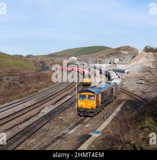 Dove Holes quarry, Derbyshire.  GB Railfreight class 66 locomotive  66786 Loading a train of aggregates hoppers with class 56 56301 shunting behind. Stock Photo