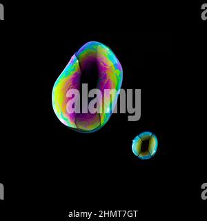 Soap Bubbles in colorful colors on black background Stock Photo