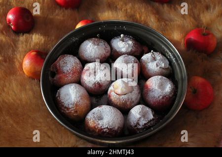red apples baked and covered white sweet powder nice healthy dessert Stock Photo