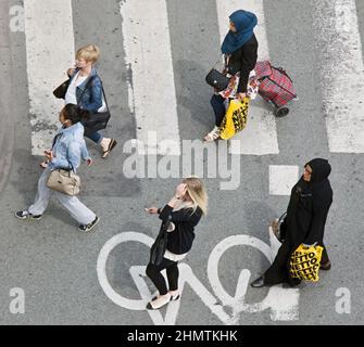 View of women from different nationalities crossing the street -integration and immigration concept Stock Photo