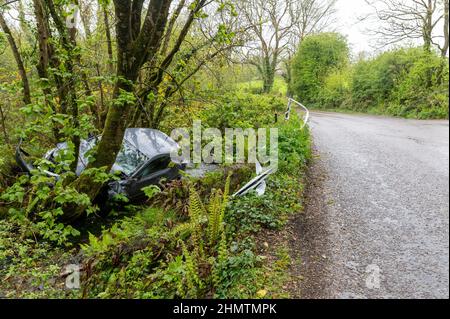 Car in ditch near Ballinspittle, Co. Cork Picture. John Allen Stock Photo