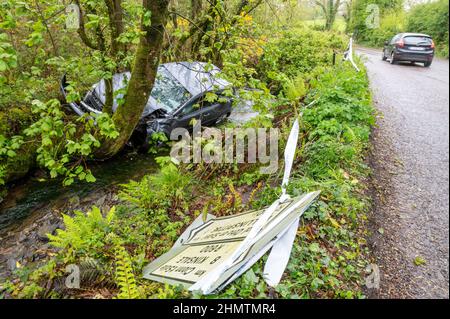 Car in ditch near Ballinspittle, Co. Cork Picture. John Allen Stock Photo