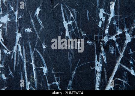 Scratched dark weathered grunge black blue metal wall texture background Stock Photo