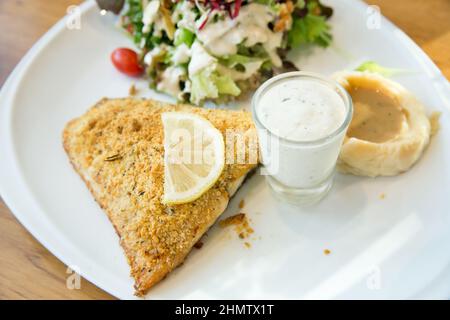 Top view of Grilled Sea Bass Steak with Salad, focus selective Stock Photo