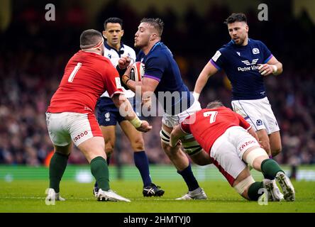 Wales' Wyn Jones (left) and Jac Morgan tackle Scotland's Matt Fagerson during the Guinness Six Nations match at the Principality Stadium, Cardiff. Picture date: Saturday February 12, 2022. Stock Photo