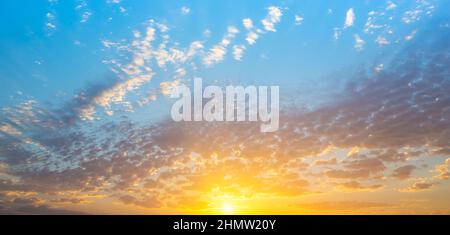 Real amazing panoramic sunrise or sunset sky with gentle colorful clouds Stock Photo