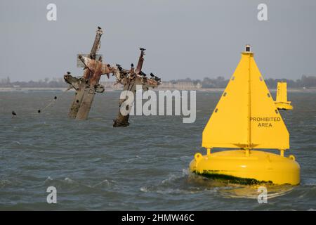 Sheerness, Kent, UK. 12th Feb, 2022. The wreck of the SS Richard Montgomery that sunk in August 1944 in the Thames Estuary off Sheerness Kent. The ship ran aground during WW2 and still contains 1,400 tonnes of explosives and now 78 years after the sinking Royal Naval bomb disposal experts have been called in to make the wreck safe by initially removing the ships masts that have remained visible within the exclusion zone placed around the vessel. Credit: MARTIN DALTON/Alamy Live News Stock Photo