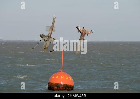 Sheerness, Kent, UK. 12th Feb, 2022. The wreck of the SS Richard Montgomery that sunk in August 1944 in the Thames Estuary off Sheerness Kent. The ship ran aground during WW2 and still contains 1,400 tonnes of explosives and now 78 years after the sinking Royal Naval bomb disposal experts have been called in to make the wreck safe by initially removing the ships masts that have remained visible within the exclusion zone placed around the vessel. Credit: MARTIN DALTON/Alamy Live News Stock Photo