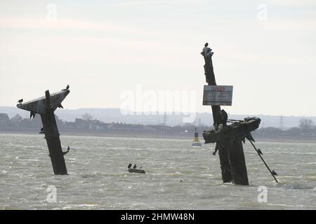 Sheerness, Kent, UK. 12th Feb, 2022. The wreck of the SS Richard Montgomery that sunk in August 1944 in the Thames Estuary off Sheerness Kent. The ship ran aground during WW2 and still contains 1,400 tonnes of explosives and now 78 years after the sinking Royal Naval bomb disposal experts have been called in to make the wreck safe by initially removing the ships masts that have remained visible within the exclusion zone placed around the vessel. Credit: MARTIN DALTON/Alamy Live News Stock Photo