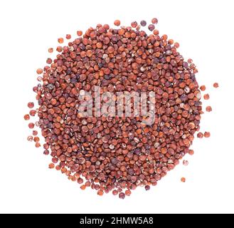 Red quinoa seeds isolated on white background. Pile of raw kinwa. Top view. Stock Photo