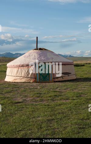A traditional yurt or ger which portable, round tent covered with felt ...