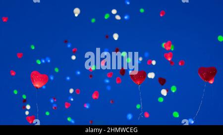 Colorful LED balloon in night sky. Romantic style love concept, Valentines holiday Stock Photo