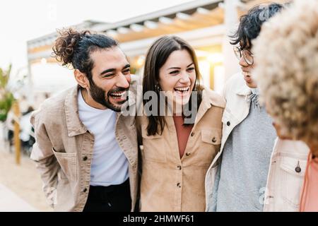 Group of young diverse friends having fun on party at beach Stock Photo