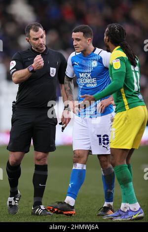 PETERBOROUGH, UK. FEB 12TH. Match referee, Tim Robinson speaks to Oliver Norburn of Peterborough United and Daniel Johnson of Preston North End during the Sky Bet Championship match between Peterborough United and Preston North End at Weston Homes Stadium, Peterborough on Saturday 12th February 2022. (Credit: James Holyoak | MI News) Credit: MI News & Sport /Alamy Live News Stock Photo