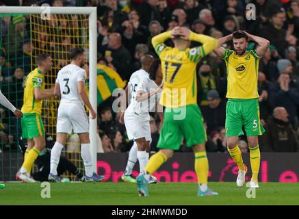 Norwich City's Grant Hanley (right) reacts after his header hit the post during the Premier League match at Carrow Road, Norwich. Picture date: Saturday February 12, 2022. Stock Photo