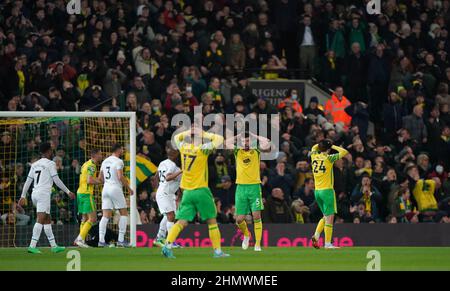 Norwich City's Grant Hanley (second right) reacts after his header hit the post during the Premier League match at Carrow Road, Norwich. Picture date: Saturday February 12, 2022. Stock Photo