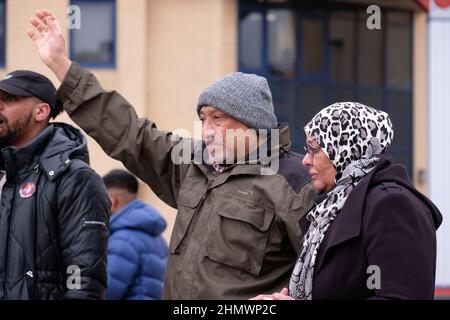 Newport, Gwent, Wales - Saturday 12th February 2022 - The parents of Mouayed Bashir at todays protest - Mouayed Bashir died after being restrained by Gwent Police at their home in Newport one year ago in February 2021 - The Independent Office for Police Conduct ( IOPC ) is still investigating the death. Photo Steven May / Alamy Live News Stock Photo