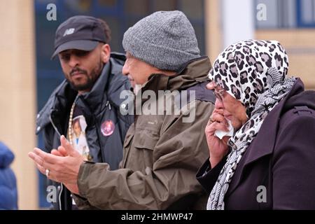 Newport, Gwent, Wales - Saturday 12th February 2022 - The parents of Mouayed Bashir ( on right ) join their son Mohammed ( left ) at todays protest - Mouayed Bashir died after being restrained by Gwent Police at their home in Newport one year ago in February 2021 - The Independent Office for Police Conduct ( IOPC ) is still investigating the death. Photo Steven May / Alamy Live News Stock Photo