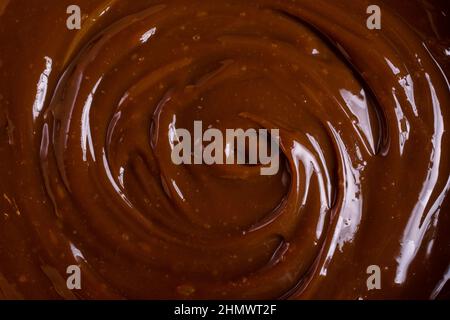 Delicious chocolate cream or brown caramel sauce as ingredient for tasty homemade dessert Stock Photo