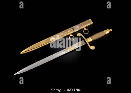 souvenir collectible silver gold dagger with scabbard on black. Luxury ...