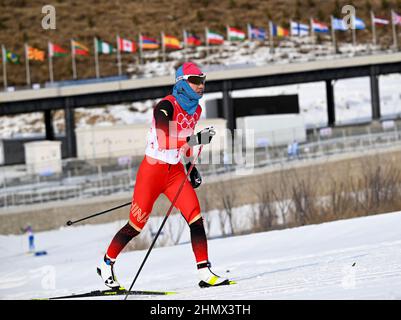 Zhangjiakou, China's Hebei Province. 12th Feb, 2022. Chi Chunxue of China competes during the cross-country skiing women's 4x5 km relay of the Beijing Winter Olympics at National Cross-Country Skiing Centre in Zhangjiakou, north China's Hebei Province, Feb. 12, 2022. Credit: Feng Kaihua/Xinhua/Alamy Live News Stock Photo