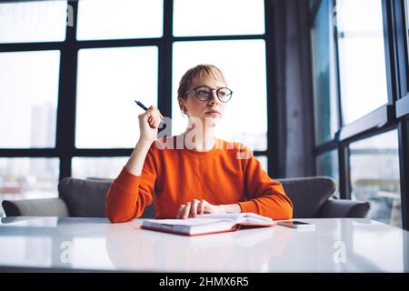 Young student doing homework in light lounge Stock Photo