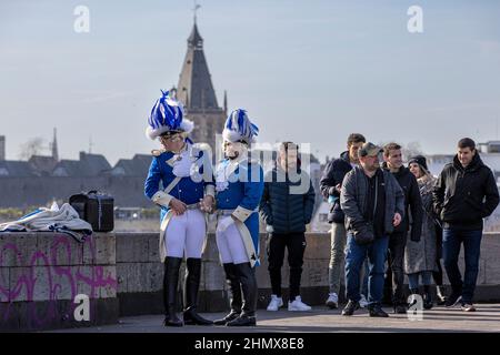 Two men dressed in medieval German uniform during Cologne carnival season Stock Photo