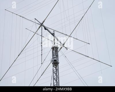 A tall ham radio antenna with some snow on it. Close up. Stock Photo