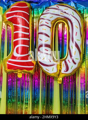 Beautiful card, Happy birthday greetings to a ten year old child, card with the number 10 years happy birthday. Background with festive decorations. Stock Photo