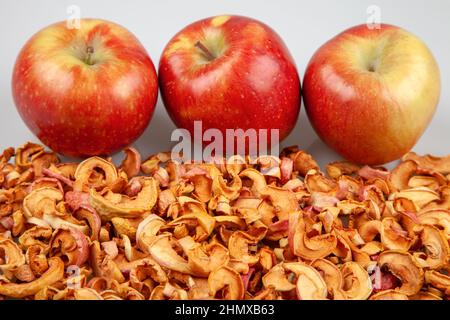 Fresh red apples on dried apple slices Stock Photo