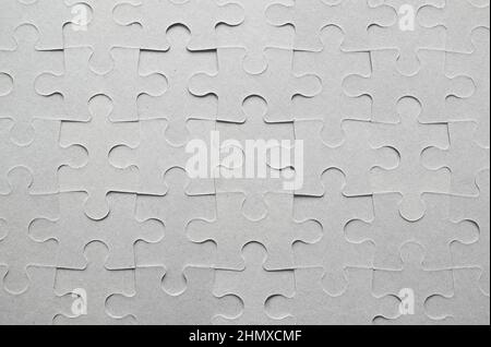 Background of the finished cardboard puzzle without drawing. Copy space. Stock Photo