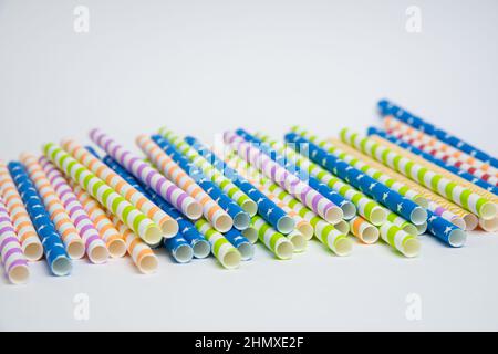 Colorful helical or striped paper straws isolated on white background including clipping path. Stock Photo