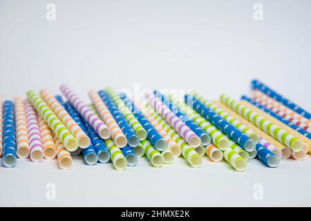 Colorful helical or striped paper straws isolated on white background including clipping path. Stock Photo
