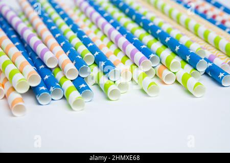 Colorful helical or striped paper straws isolated on white background including clipping path. Stock Photo