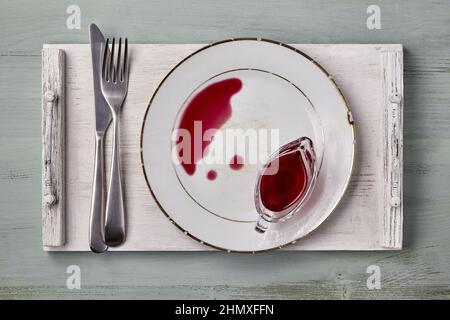 White vintage ceramic plate with spilled berry sauce Stock Photo