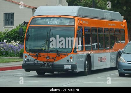 Los Angeles, CA / USA - June 29, 2020: A Metro Local bus is shown with a FACE COVERING REQUIRED notice shown on the digital LED display. Stock Photo