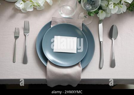 Stylish table setting with blank card Stock Photo