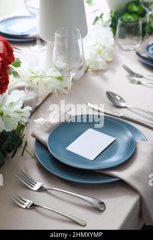 Stylish table setting with blank card Stock Photo