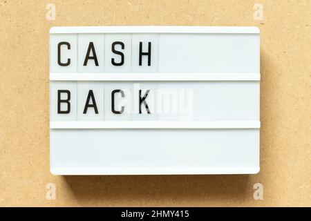 Lightbox with word cash back on wood background Stock Photo