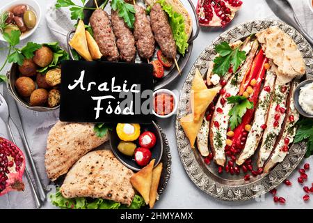 Lebanese food assortment on light background. Traditional food concept. Top view, flat lay Stock Photo