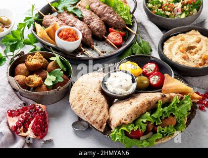 Lebanese food assortment on light background. Traditional food concept. copy space Stock Photo