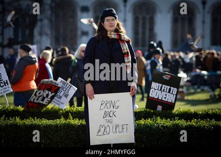 London, UK 12 th February 2022. Campaigners gathered on Parliament Square in protest against the rises in fuel prices and costs of living. Stock Photo